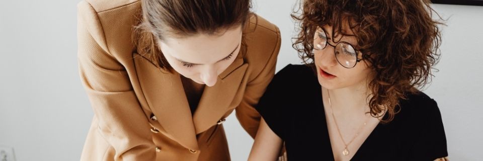 Mortgage bond specialist reviewing NMLS licensing requirements with client