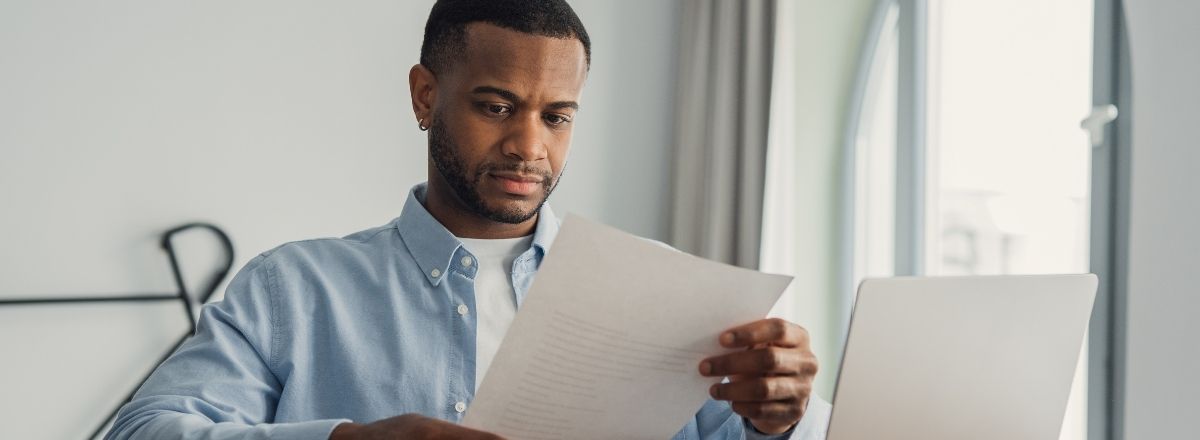 Person carefully reviewing VA fiduciary bond documents