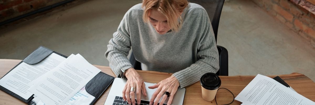 Business owner completing dealer bond application online